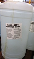 clear drum, clear liquid, label - Balance Sour